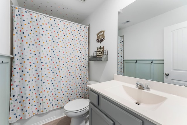 23830 Via Leoni Dr, New Caney, TX 77357 - full bath featuring toilet, vanity, and shower / bath combo with shower curtain
