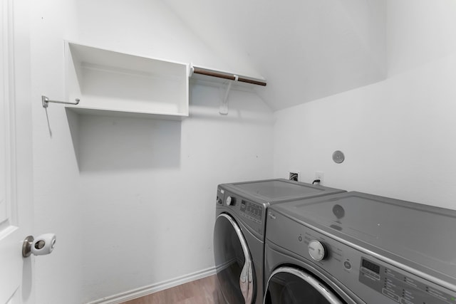23830 Via Leoni Dr, New Caney, TX 77357 - laundry area featuring washer and clothes dryer and dark wood-type flooring
