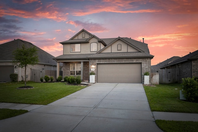 23830 Via Leoni Dr, New Caney, TX 77357 - traditional home with a garage, driveway, brick siding, a shingled roof, and a gate