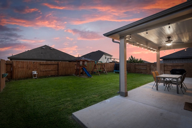 23830 Via Leoni Dr, New Caney, TX 77357 - view of yard featuring a playground, a patio, outdoor dining space, and ceiling fan
