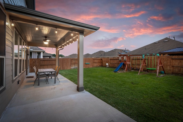 23830 Via Leoni Dr, New Caney, TX 77357 - view of yard with a patio area, a playground, ceiling fan, and outdoor dining space