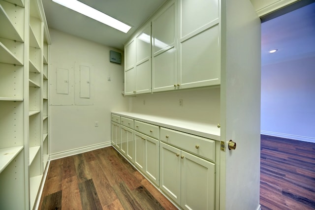 interior space with recessed lighting, dark wood-style flooring, and baseboards