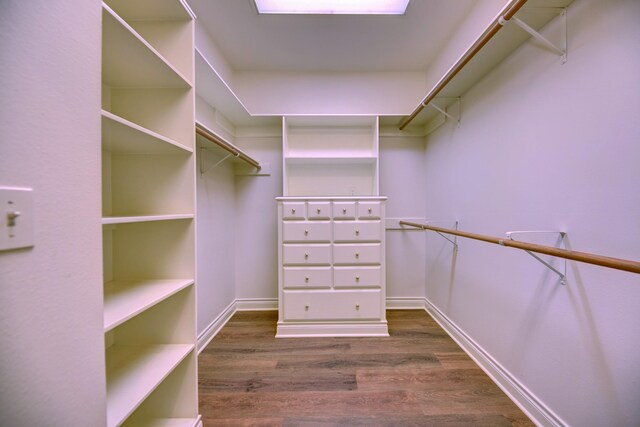 walk in closet featuring dark wood-style flooring