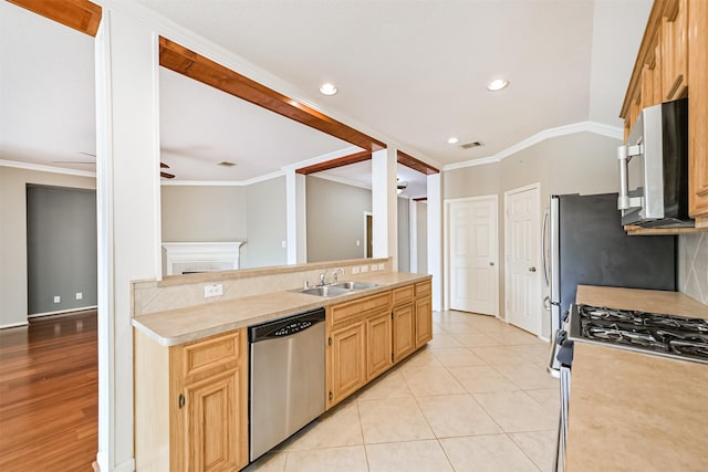 kitchen with a ceiling fan, a sink, stainless steel appliances, light countertops, and visible vents