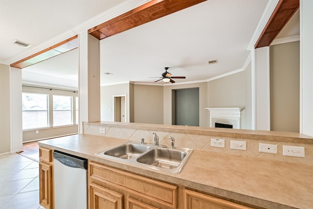 kitchen featuring stainless steel dishwasher, crown molding, a sink, ceiling fan, and light countertops