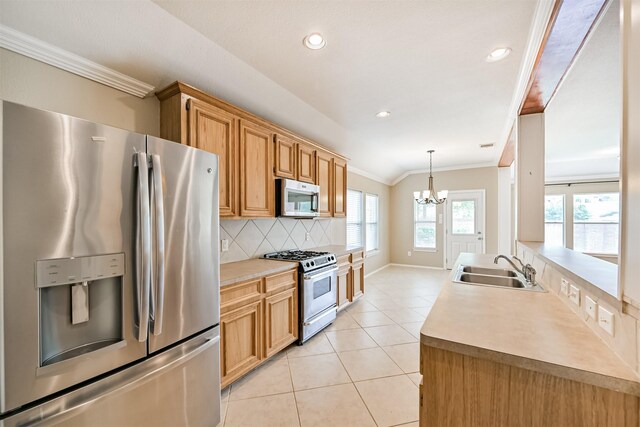 kitchen with a sink, decorative backsplash, light tile patterned floors, ornamental molding, and appliances with stainless steel finishes