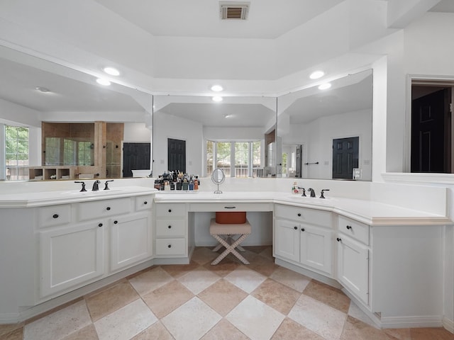 full bathroom with a sink, two vanities, recessed lighting, and visible vents