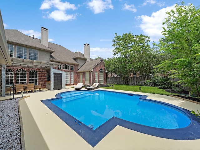 view of swimming pool with a patio area, a fenced in pool, a fenced backyard, a yard, and a pergola