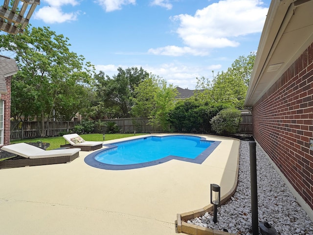 view of pool featuring a patio, a fenced in pool, and a fenced backyard