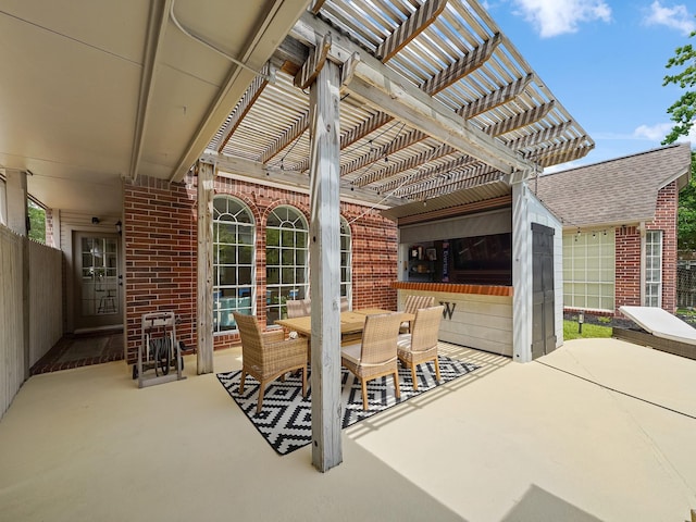 view of patio with a pergola and outdoor dining space