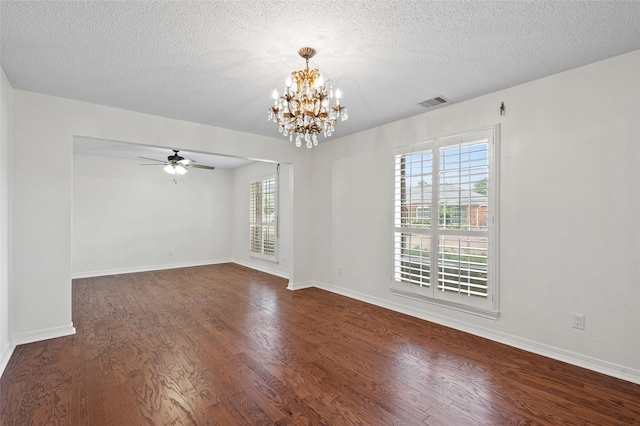 7 Colony Park Cir, Galveston, TX 77551 - unfurnished room featuring dark wood-style floors, a textured ceiling, visible vents, and ceiling fan with notable chandelier