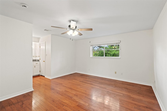 7 Colony Park Cir, Galveston, TX 77551 - spare room with baseboards, visible vents, a ceiling fan, and light wood-style floors