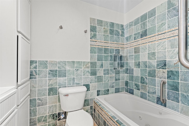 7 Colony Park Cir, Galveston, TX 77551 - full bath with tile walls, toilet, and a whirlpool tub