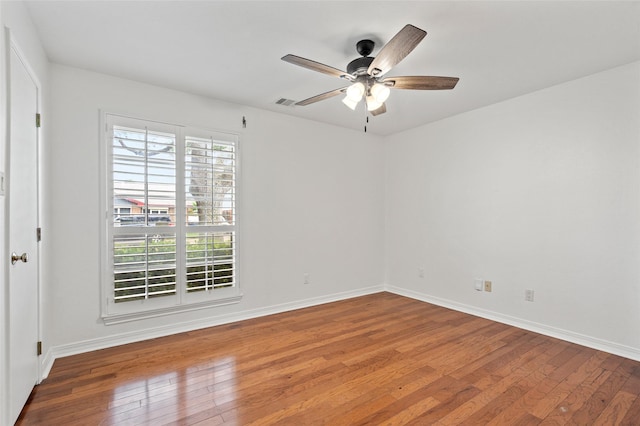 7 Colony Park Cir, Galveston, TX 77551 - empty room with hardwood / wood-style flooring, a ceiling fan, and baseboards