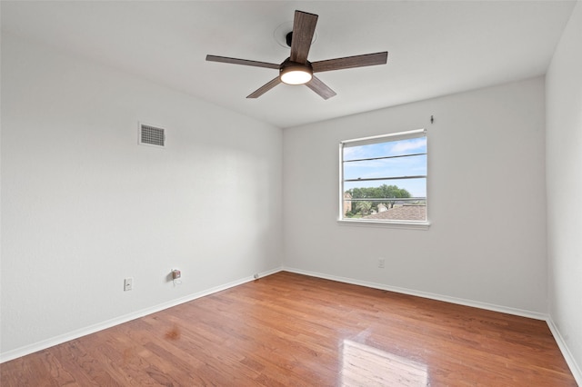 7 Colony Park Cir, Galveston, TX 77551 - spare room with visible vents, a ceiling fan, light wood-style flooring, and baseboards