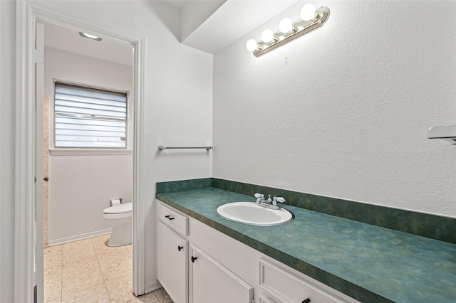 7 Colony Park Cir, Galveston, TX 77551 - bathroom featuring toilet and vanity