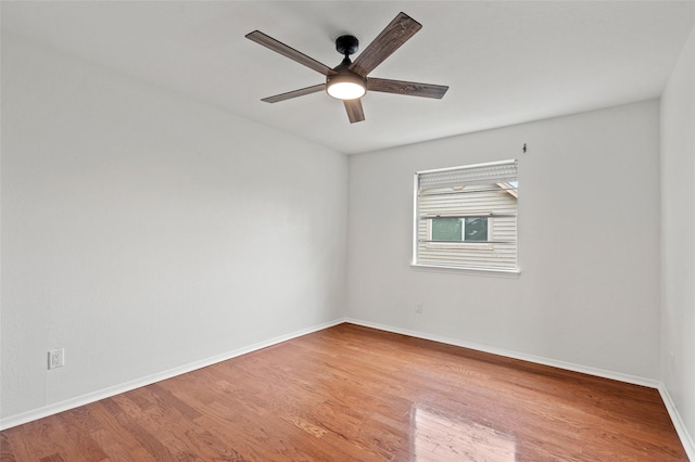 7 Colony Park Cir, Galveston, TX 77551 - empty room featuring wood finished floors, ceiling fan, and baseboards