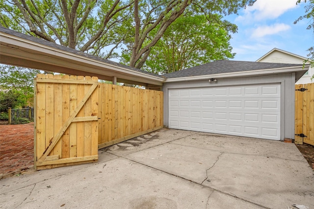 7 Colony Park Cir, Galveston, TX 77551 - garage featuring a gate and fence