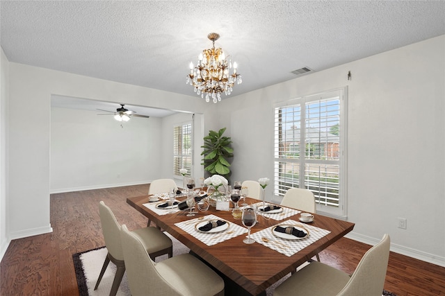 7 Colony Park Cir, Galveston, TX 77551 - dining space with visible vents, baseboards, a textured ceiling, wood finished floors, and ceiling fan with notable chandelier