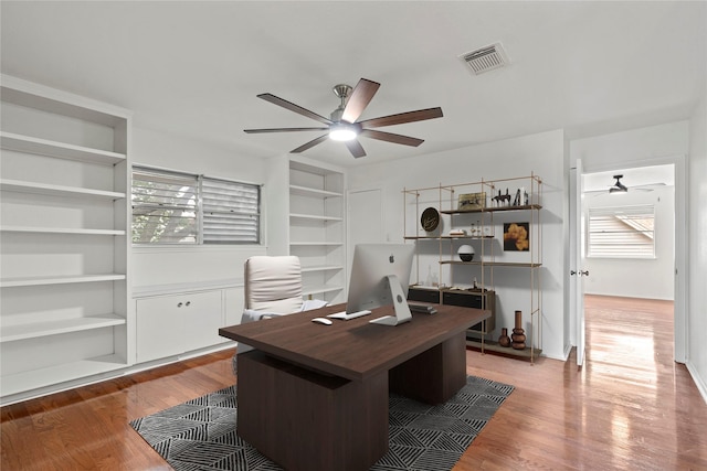 7 Colony Park Cir, Galveston, TX 77551 - home office featuring visible vents, a healthy amount of sunlight, and a ceiling fan