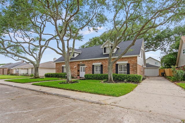 7 Colony Park Cir, Galveston, TX 77551 - cape cod-style house with a front lawn, a shingled roof, a garage, brick siding, and fence