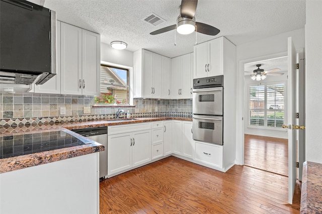 7 Colony Park Cir, Galveston, TX 77551 - kitchen featuring appliances with stainless steel finishes, ceiling fan, visible vents, and a sink