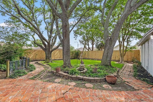 7 Colony Park Cir, Galveston, TX 77551 - view of yard with a patio and a fenced backyard