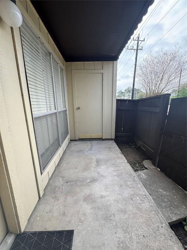 view of patio featuring fence