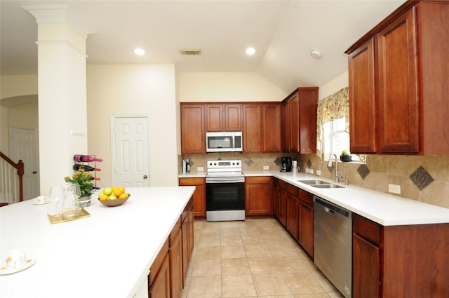 7214 Paradise Park Bnd, Richmond, TX 77407 - kitchen featuring visible vents, a sink, backsplash, and appliances with stainless steel finishes
