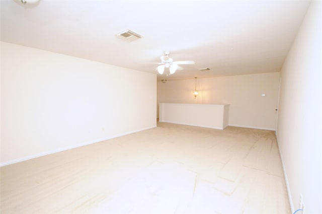 7214 Paradise Park Bnd, Richmond, TX 77407 - unfurnished room with visible vents, a ceiling fan, baseboards, and light carpet