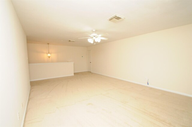 7214 Paradise Park Bnd, Richmond, TX 77407 - empty room with light carpet, baseboards, visible vents, and ceiling fan