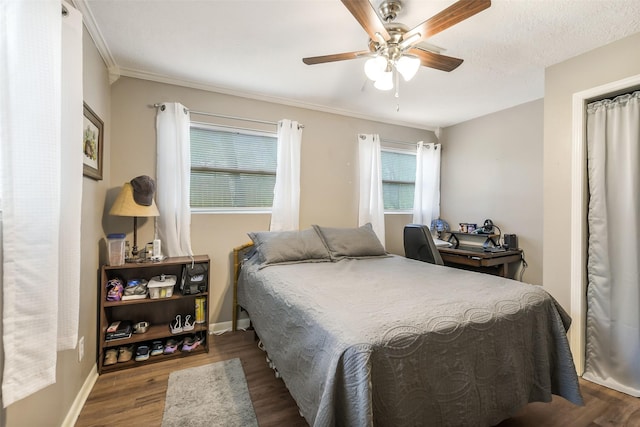 27011 Azalea Ct, Magnolia, TX 77354 - bedroom with baseboards, wood finished floors, ceiling fan, and crown molding