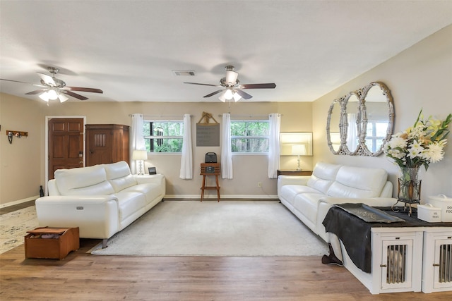 27011 Azalea Ct, Magnolia, TX 77354 - living room with baseboards, a ceiling fan, wood finished floors, and visible vents