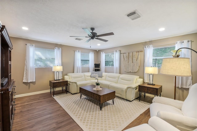 27011 Azalea Ct, Magnolia, TX 77354 - living area featuring baseboards, wood finished floors, visible vents, and a ceiling fan