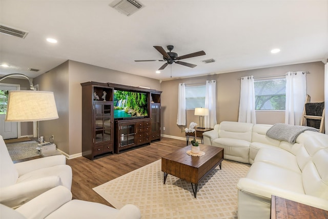 27011 Azalea Ct, Magnolia, TX 77354 - living room with baseboards, wood finished floors, and visible vents