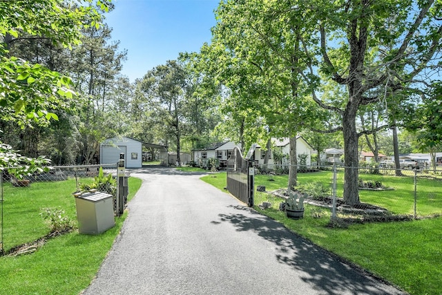 27011 Azalea Ct, Magnolia, TX 77354 - view of road featuring a residential view and aphalt driveway