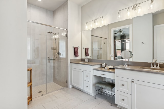 1919 Hickory Grove Ln, Tomball, TX 77375 - full bath featuring a shower stall, tile patterned flooring, vanity, and a ceiling fan