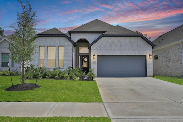 1919 Hickory Grove Ln, Tomball, TX 77375 - french country style house featuring a garage, a front yard, brick siding, and concrete driveway
