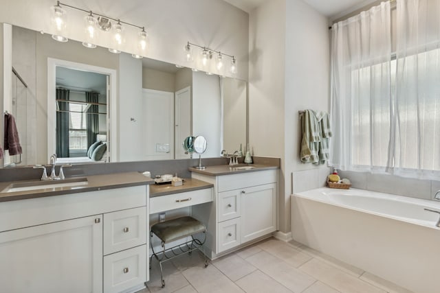 1919 Hickory Grove Ln, Tomball, TX 77375 - full bath with tile patterned floors, a garden tub, and vanity