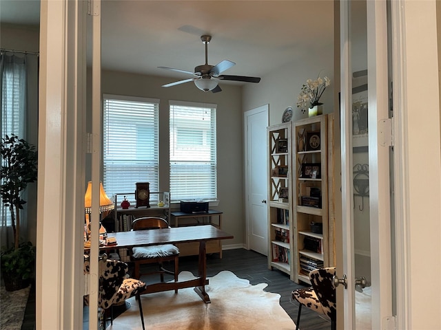 1919 Hickory Grove Ln, Tomball, TX 77375 - home office with baseboards, dark wood-style floors, and ceiling fan