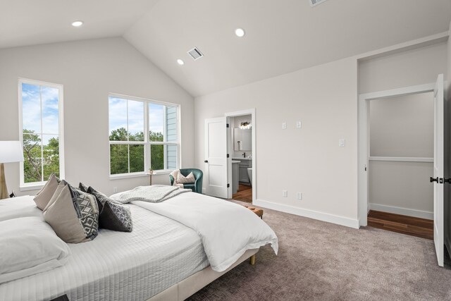 bedroom with multiple windows, carpet, lofted ceiling, and visible vents