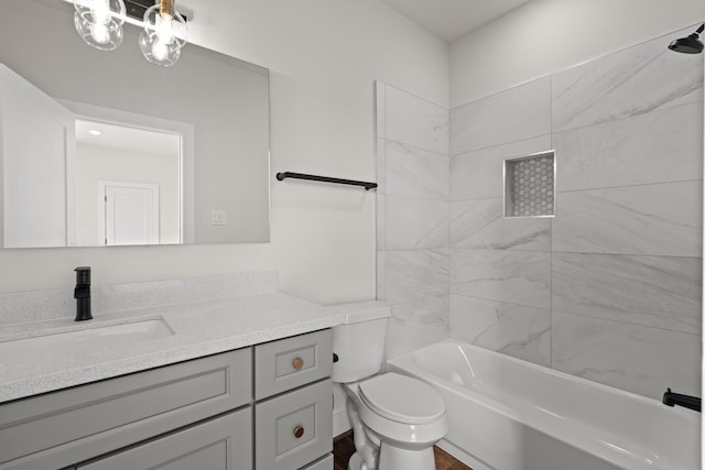 bathroom with toilet, tub / shower combination, and vanity
