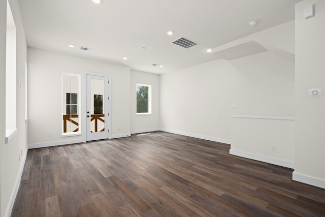 unfurnished room with dark wood finished floors, baseboards, recessed lighting, and visible vents