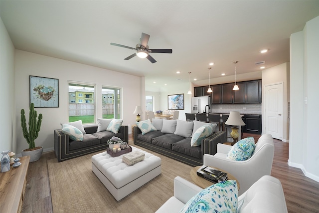 1934 32nd Ave N, Texas City, TX 77590 - living room featuring wood finished floors, ceiling fan, baseboards, and recessed lighting
