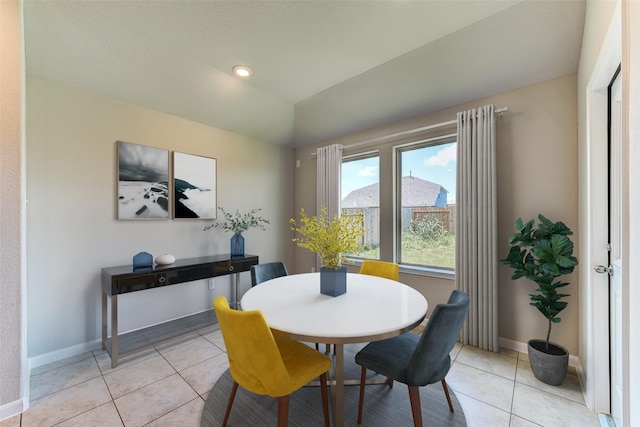 1934 32nd Ave N, Texas City, TX 77590 - dining space featuring light tile patterned flooring, baseboards, and vaulted ceiling