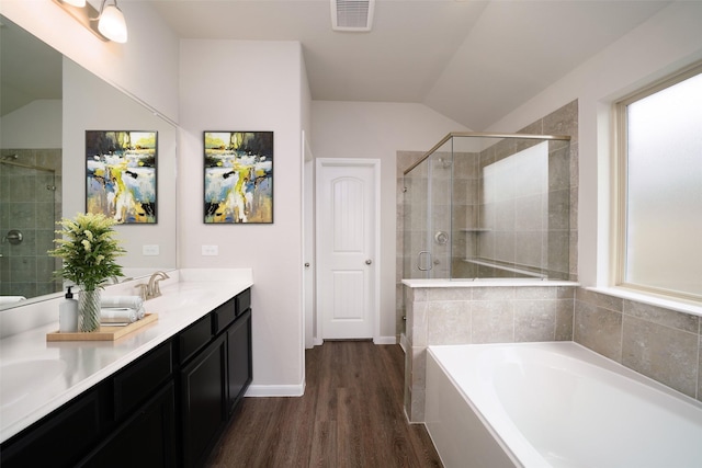 1934 32nd Ave N, Texas City, TX 77590 - bathroom with a stall shower, a bath, visible vents, a sink, and wood finished floors