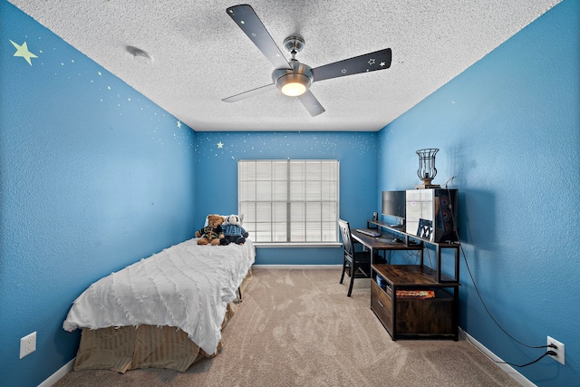 17203 Meadow Heights Dr, Houston, TX 77095 - carpeted bedroom with ceiling fan, baseboards, and a textured ceiling
