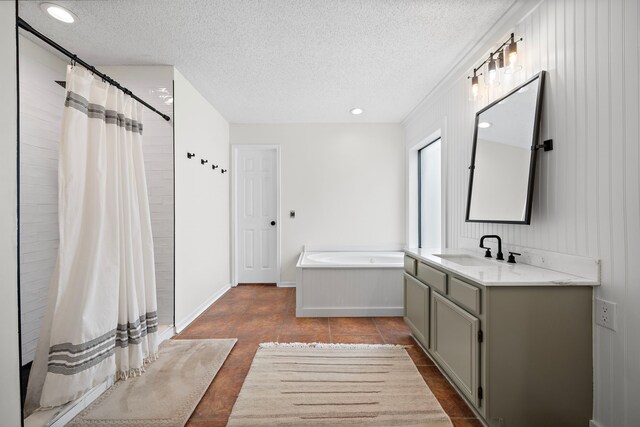 17203 Meadow Heights Dr, Houston, TX 77095 - full bath with a shower with curtain, a textured ceiling, recessed lighting, vanity, and a garden tub