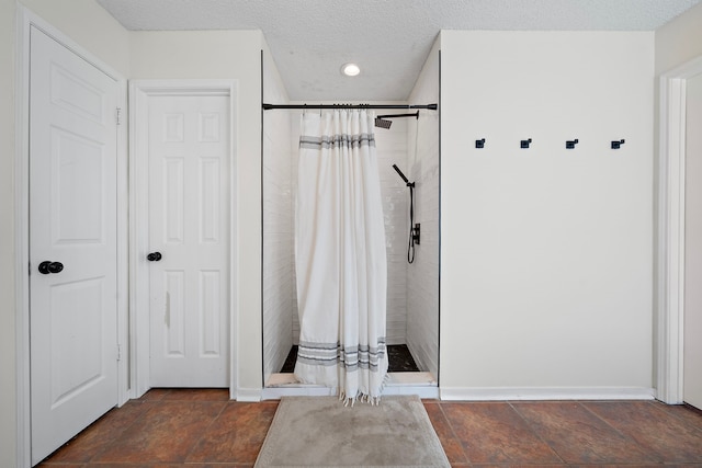 17203 Meadow Heights Dr, Houston, TX 77095 - full bath with tiled shower, baseboards, stone finish flooring, and recessed lighting