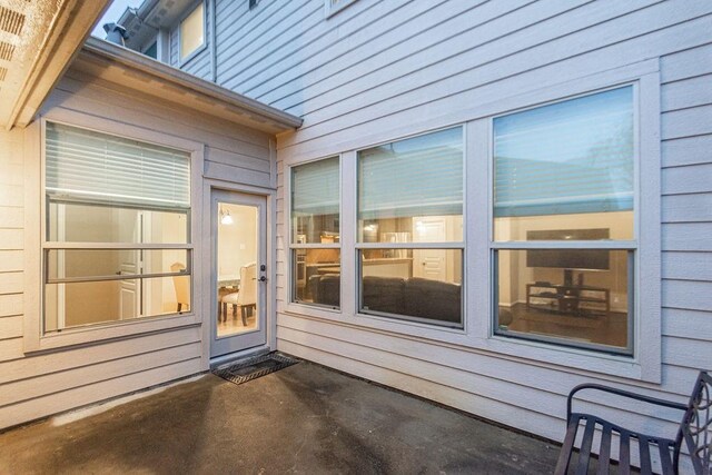 entrance to property featuring a patio